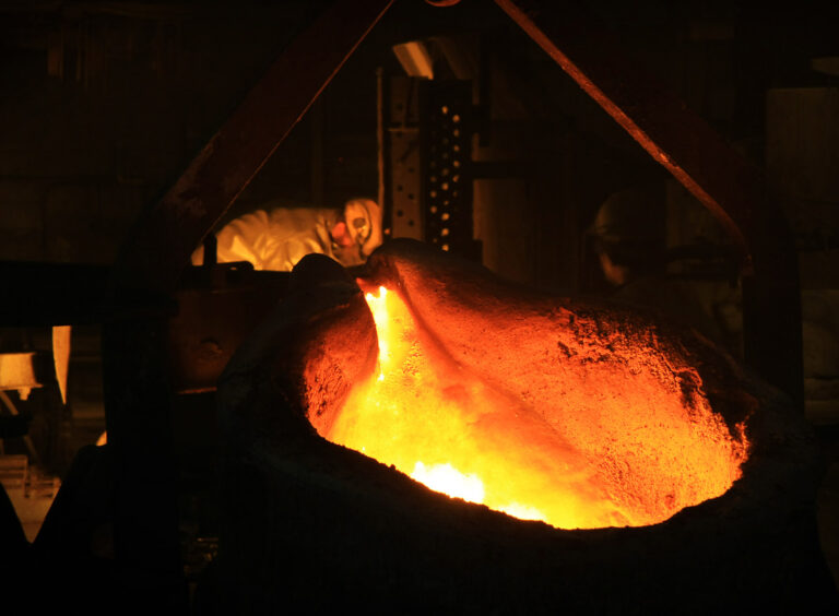 The centrifugal casting method creates a denser and less porous material.